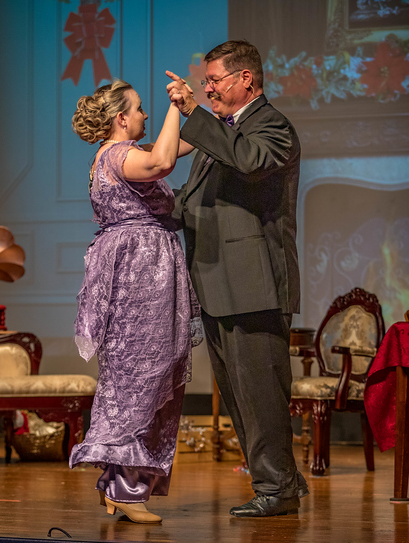 Mr. & Mrs. Smith leading the Christmas party waltz